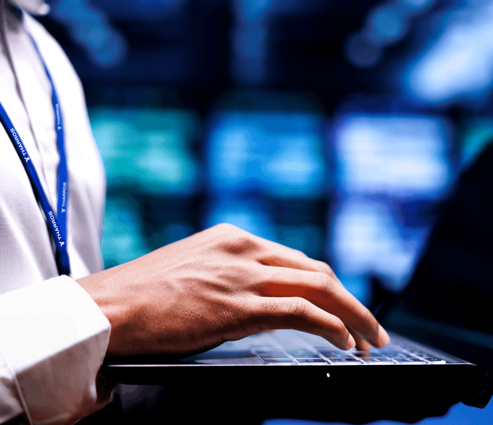 close up of male hands typing on a laptop